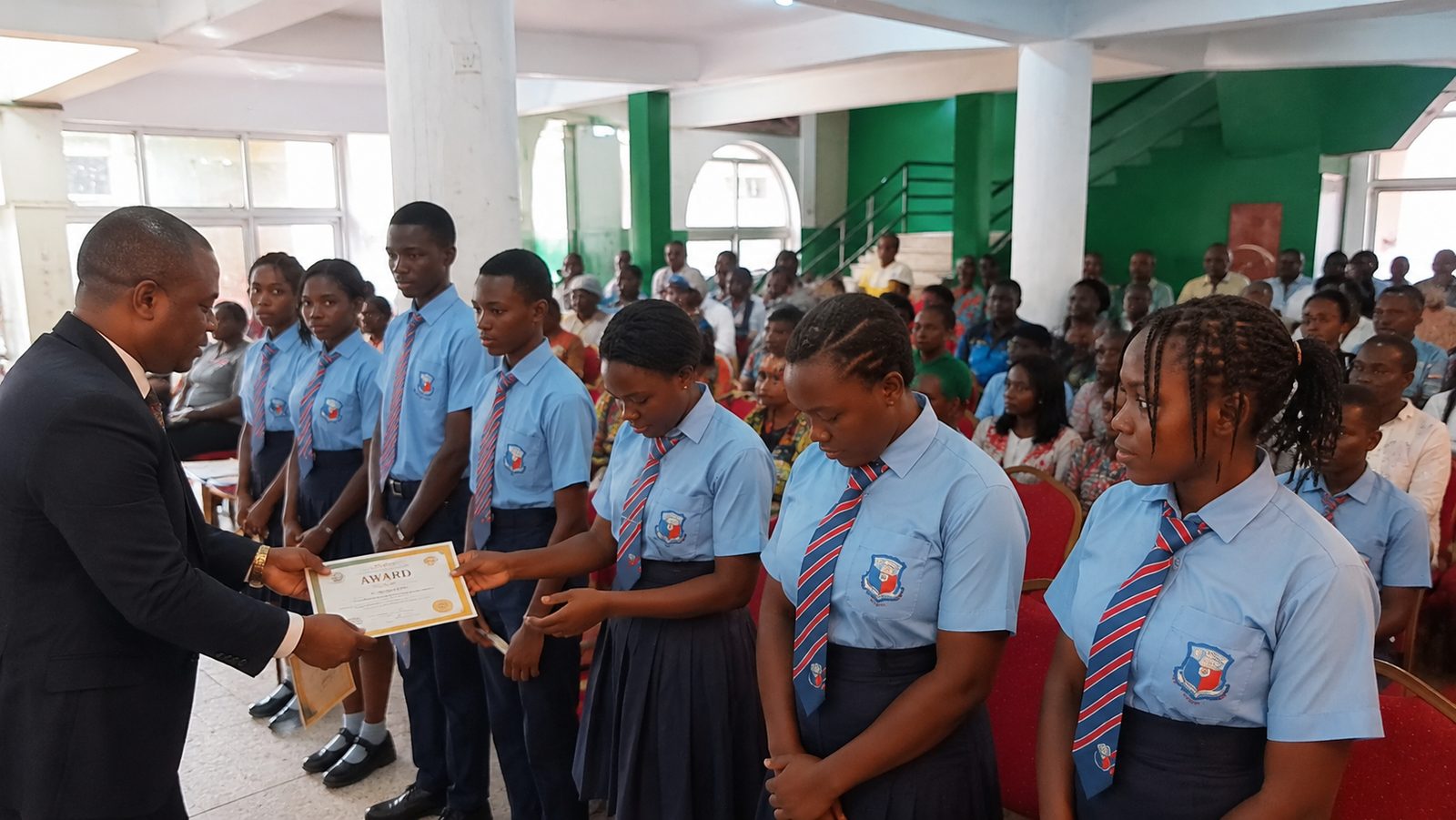 Students lined up receiving awards at a Grait International College ceremony